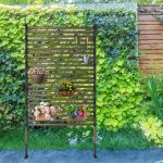 The privacy screen is located by the wall
