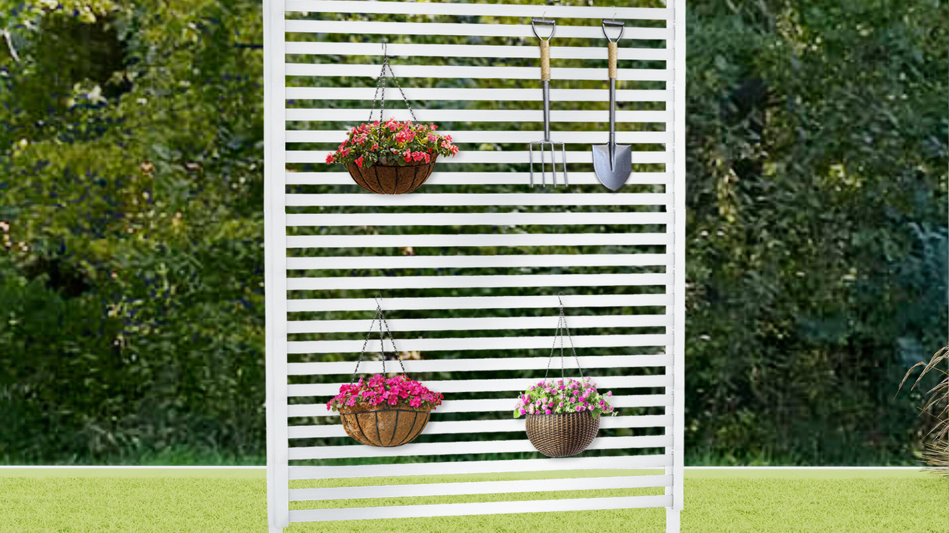 White slatted metal privacy screen standing on a lawn with hanging flower baskets